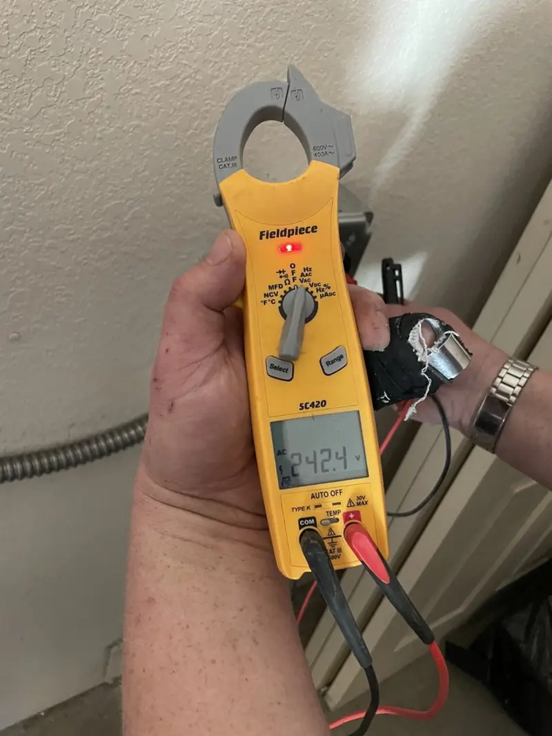 Voltage testing with clamp meter during Electrical Installation Services in Fairview Shores